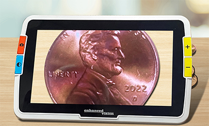 Amigo displaying magnified image of a coin